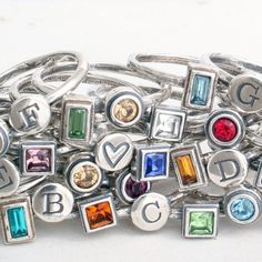 "How fun is it to make your own ring using the initials and birthstones of those you love?! Unleash the inner jewelry designer and pick from all of our hand crafted silver bands and birthstone rings to build a family ring or mother's ring you will cherish forever. Also available in gold bands at this listing: https://www.etsy.com/listing/825827495 ♥♥ HOW TO ORDER ♥♥- 1. CHOOSE YOUR SIZE 2. CHOOSE YOUR COMBINATION 3. IN THE COMMENTS SECTION AT CHECKOUT PLEASE INCLUDE: a. WHAT INITIALS AND/OR SYMB Mothers Ring Stackable, October Jewelry, Initial Rings, April Birthstone Ring, Stackable Birthstone Rings, Mother's Ring, Stack Rings, Stackable Ring Sets, Design Your Own Ring