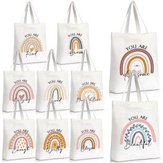 six totes with rainbows and you are my sunshine written on the front in white