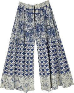 An off-white wide-leg palazzo pants with grey and blue floral and artistic prints.  These flowy palazzo pants have an elasticated waist with a drawstring that has small bells attached to its end. #tlb #SplitSkirtsPants #Printed #WideLegPants #PrintedPants #CottonPalazzos Blue Flare Wide Leg Pants For Summer, Blue Floral Print Wide Leg Pants For Summer, Printed Blue Wide Leg Pants For Spring, Blue Printed Wide Leg Pants For Spring, Spring Blue Printed Wide Leg Pants, Blue Bohemian Palazzo Set For Festivals, Blue Bollywood Palazzo Set With Printed Motifs, Summer Printed Blue Wide Leg Pants, Blue Cotton Palazzo Set With Floral Print