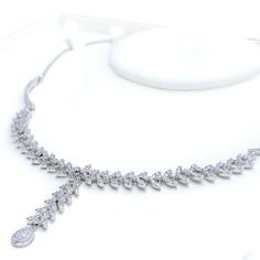 Radiant White Gold Diamond Necklace Set - the perfect addition to any sophisticated ensemble. Crafted from 18k white gold and weighing 24.1 grams, this piece features stunning round diamonds with a total weight of 2.96ct, set in a beautiful 17.5" necklace with a 1.25" drop length. It also comes with matching earrings with a length of 1.25" and screw backs for secure wearing. The lobster lock ensures this set stays safely in place, making it the perfect accessory for any occasion. PRODUCT DETAILS Luxury Silver Marquise Necklace, Exquisite Silver Marquise Necklace, Luxury Marquise White Gold Necklaces, Luxury White Gold Marquise Necklace, Luxury Marquise White Gold Necklace, Platinum Marquise Necklace For Wedding, Elegant Hand Set Marquise Jewelry, Wedding Platinum Marquise Necklace, Elegant Hand-set Marquise Jewelry