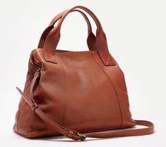 Crafted of soft, slouchy leather with an on-trend A-line silhouette, the Ada satchel will be your main carrying companion through the spring/summer season and beyond. Take a peek inside to find tons of function, with a triple-compartment design and plenty of pockets to handle your everyday essentials. Score!  Sling the adjustable crossbody strap over your shoulder and enjoy hands-free convenience while you're out running errands. Or slide the top handles through the crook of your arm and display Fall Textured Leather Hobo Bag For Travel, Fall Travel Textured Leather Hobo Bag, Fall Travel Hobo Bag With Textured Leather, Leather Satchel With Double Handle For Spring, Spring Leather Satchel With Double Handle, Leather Satchel For On-the-go Spring, Casual Textured Leather Double Handle Satchel, Casual Textured Leather Satchel With Double Handle, Spring Leather Satchel With Top Carry Handle