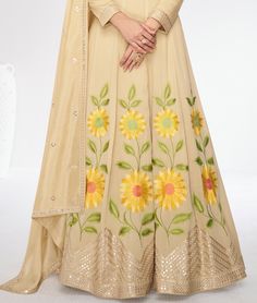 COLOR : Dull Yellow Cream FABRIC : Gown & Dupatta - Premium Silk WORK : Resham Embroidery, Hand Work, Sequins, Floral Motifs, Lace Border OCCASION : Wedding, Reception, Mehendi, Party Wear, Festival READY-TO-WEAR : No STITCHING : Available as semi-stitched fabric, can be stitched using standard size option (+$30). Note: There might be a slight color variation due to lighting and flash used during photoshoot. The bright shade seen is the best closer view of fabric's color. Floor-length Anarkali With Resham Embroidery, Navratri Floor-length Sets With Floral Embroidery, Floor-length Anarkali Traditional Wear With Resham Embroidery, Floor-length Anarkali Set With Dori Work For Diwali, Unstitched Floor-length Anarkali Set With Dori Work, Floral Embroidery Anarkali Set For Navratri, Floral Embroidered Anarkali Set For Navratri, Anarkali Set With Floral Embroidery, Anarkali Set With Floral Embroidery For Navratri