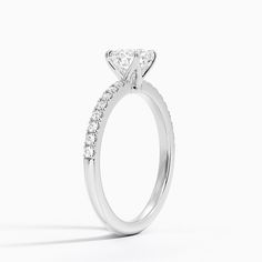 a diamond engagement ring on a white background