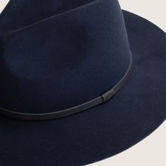 The Anderson hat is a floppy, wide brim fedora, made from super soft Australian wool, making it packable and ideal for travelling. The hat is available in navy and is trimmed with natural black leather. Elegant Wide Brim Felt Hat For Travel, Classic Navy Wide Brim Hat, Classic Navy Hat With Flat Brim, Classic Navy Flat Brim Hat, Chic Wide Brim Leather Hat, Chic Leather Wide Brim Hat, Navy Travel Hat With Curved Brim, Blue Fedora Hat For Travel, Travel Fedora With Wide Brim In Fur Felt