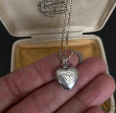 70s VINTAGE SILVER Locket and 16 inch Chain, Sterling Silver Engraved Pendant Necklace, Vintage Silver Jewelry, Heart Vintage Locket offered by Isobel Vintage Jewels on Etsy Style: Vintage 1970s real silver locket. A lovely heart shaped 70s side opening sterling silver locket big enough for putting little photos inside. You can add engraving to it as there is a space on the front for a name to be engraved! Colour: silver  Size: 2 x 2 cm and 16 inch chain Condition: Excellent condition Approximat Vintage Necklace With Heart Charm, Vintage Necklace With Heart Charm As Gift, Vintage Necklace With Heart Charm For Gift, Vintage Heart Charm Necklace As Gift, Vintage Necklace For Valentine's Day, Vintage Heart Necklace With Vintage Charm For Anniversary, Vintage Necklaces With Vintage Charm For Valentine's Day, Vintage Heart Necklace With Charm For Anniversary, Vintage Heart-shaped Necklace For Gift