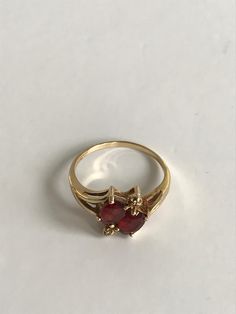 Ladies 14k Yellow Gold Vintage Two Stone Garnet Ring Ladies Size 7.5 * makes an excellent gift choice * unique ring- will not go unnoticedDisclaimer: All items in our store are vintage and pre-loved, which means they may show signs of gentle wear, including small dings, scratches, or other imperfections that add to their unique character. We do our best to describe and photograph each item accurately, but please feel free to reach out with any questions before purchasing. Thank you for appreciat Formal Rings With Prong Setting For Valentine's Day, 14k Stamped Diamond Ring For Valentine's Day, Stamped 14k Diamond Ring For Valentine's Day, Heirloom Oval Rings For Valentine's Day, Valentine's Day 14k Stamped Fine Jewelry Diamond Ring, Valentine's Day Heirloom Oval Rings, Yellow Gold Rings With Prong Setting For Valentine's Day, Formal 14k Gold Heart Ring Stamped 14k, 14k Gold Ruby Ring For Formal Occasions