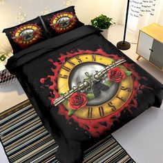 a bed covered in a black comforter with red roses on it and a clock