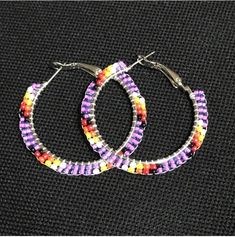 Purple Beaded Hoop Earrings Colorful Beads Hoop Earrings, Small Hoop Earrings With Tiny Beads For Festivals, Small Silver Hoop Earrings With Colorful Beads, Silver Small Hoop Earrings With Colorful Beads, Circular Beaded Earrings For Festivals, Festival Small Hoop Earrings With Dangling Beads, Purple Bohemian Hoop Earrings, Purple Beaded Hoop Earrings With Round Beads, Colorful Beaded Circle Earrings