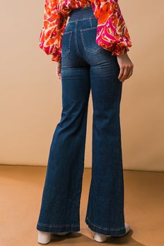 The GRAND PARTY DENIM JEANS features a high-quality washed denim fabric with a wide waistband for added comfort and unique stitching for a stylish look. It has a 2 button and zipper closure, plus front and back pockets and boot-cut leg opening, making it perfect for all occasions. Details Self: 68% Cotton, 20% Polyester, 10% Rayon, 2% Spandex Lining: 95% Polyester, 5% Cotton Size & Fit - Model is 5`8" And Wearing Size Small - Measurements Taken From Size Small - Approx Length: 43.5" Fall Denim Flare Jeans Full Length, Flare Washed Denim Jeans, High Waist Denim Blue Jeans For Fall, High Rise Denim Flare Jeans For Fall, Medium Wash Flare Cotton Jeans, High-waist Denim Jeans For Fall, Trendy Denim Flare Jeans With Button Closure, Retro Fall Jeans With Button Closure, Dark Wash Denim Flare Jeans