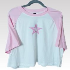 This Pink And White Graphic T-Shirt In Womens Plus Size 4xl Is New With Tags! This Cropped Crew Neck Short Sleeve Top Features A Front Graphic Logo Displaying A Pink Hollowed Out Star. A Great Addition To Your On The Go T-Shirt Collection. Features A Baseball Style Cut With Short Raglan Sleeves. Top Is Made Of A Stretch Knit And Oversized For Added Comfort... *Measurements & Details: Bust/Chest (Ptp): 25" Length: 19" Color: Pink/White Material: 95% Polyester / 5% Spandex *Measurements Are Approx Cheap Heart Print Relaxed Fit T-shirt, Crew Neck Tops With Star Logo For Summer, Graphic Tees Cute, Casual Summer Tops With Star Logo, Casual Tops With Star Logo And Relaxed Fit, Relaxed Fit Short Sleeve Tops With Star Logo, Casual Summer T-shirt With Star Logo, Casual Relaxed Fit Tops With Star Print, White Star Print T-shirt For Spring