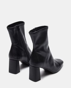 For the perfect seasonal transition style, look no further. HUSH is a sleek ankle boot with a sock-like fit and brings a chic touch to these versatile booties. 2.75 inch heel height 9.5 inch shaft circumference 6.25 inch shaft height Vegan leather or synthetic upper material Textile and vegan leather lining Vegan leather sock Synthetic sole Imported Black Ankle Boots Aesthetic, Modern Winter Boots With Sculpted Heel, Fall Medium Width Ankle Heeled Boots, Modern Mid-calf Boots With Medium Width, Sleek Medium Width Fall Boots, Modern Heeled Boots With Reinforced Heel For Winter, Sleek Boots With Reinforced Heel For Fall, Winter Ankle-high Booties With Sculpted Heel, Modern High Ankle Heeled Boots With Padded Ankle