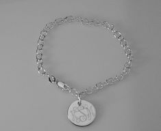 "This lovely sterling silver bracelet features a 17 gauge, high polish sterling silver 1/2\" diameter disc on a sterling silver 7\" chain, with a lobster claw clasp. I can engrave a monogram, one to three initials, or a name, date or word up to 10 characters. The back of the disc can also be engraved with up to 10 characters The bracelet will be delivered to you in a gift box. This style is also available in 8\" Length: https://www.etsy.com/listing/950524673/custom-engraved-monogram-or-initial? Classic Personalized Sterling Silver Charm Bracelet, Personalized Classic Sterling Silver Charm Bracelet, Classic Sterling Silver Personalized Charm Bracelet, Classic Sterling Silver Charm Bracelet With Silver Chain, Sterling Silver Oval Link Charm Bracelet, Classic Personalized Sterling Silver Chain Bracelet, Silver Name Bracelet With Polished Finish As Gift, Silver Name Bracelet With Polished Finish, Sterling Silver Cuff Bracelet Gift