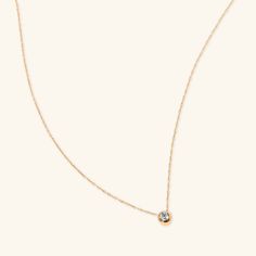 Our Diamond Bezel Necklace is feminine and dainty. A forever piece that you wear every day and pass down for generations. Can be worn alone or layered with your other fav chains. - 18k solid yellow gold - Length: 16 inches - Carat weight: 0.10 ctw - High quality diamonds, G-H color, SI1-2 clarity Classic Necklace With Smooth Bezel, Fine Jewelry Anniversary Necklace With Smooth Bezel, Fine Jewelry Necklace With Smooth Bezel For Anniversary, Fine Jewelry Necklace With Smooth Bezel Round Pendant, Fine Jewelry Necklace With Smooth Bezel, Minimalist Yellow Gold Solitaire Necklace With Smooth Bezel, Minimalist Necklace With Bezel Setting And Round Pendant, Dainty Bezel Setting Necklace For Everyday, Dainty Yellow Gold Necklace With Smooth Bezel