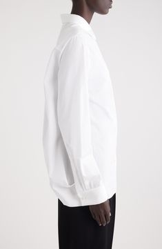 A dramatically split back carves this crisp cotton shirt that's tailored in an oversized silhouette and has voluminous lantern sleeves. 27" front length; 6" back length (size 36FR) Front button closure Point collar Long sleeves with button cuffs 100% cotton Dry clean Made in Italy Designer Clothing Modern Oversized Formal Shirt, Modern Oversized Shirt For Formal Occasions, Timeless Long Sleeve Dress Shirt For Daywear, Oversized Formal Shirt With Concealed Placket, Oversized Formal Tops With Concealed Placket, Elegant Oversized Shirt For Business, Elegant Oversized Formal Shirt, Elegant Oversized Shirt For Formal Occasions, Formal Oversized Shirt With Button Cuffs