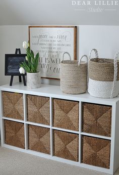 some baskets are sitting on top of a shelf