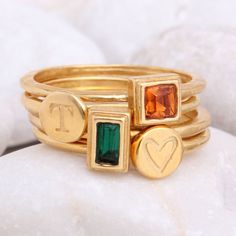 "Know someone with a May birthday ~ this is the perfect gift! Stackable birthstone rings are the IT accessory. Wear by itself or pair with with an initial ring! This listing is for one 24K gold vermeil stackable birthstone ring with a Swarovski crystal (please see color chart for color selection). Round, square, or rectangle stone settings are available. Want more rings or a different month? Build Your Own Gold Stackable Ring listing: https://www.etsy.com/listing/250020772 Also, available in SIL Gold Stackable Rings With Initials For Everyday, Everyday Gold Stackable Rings With Initials, Gold Stackable Rings For May Birthstone, Gold Stackable Rings With May Birthstone, Gold Stackable Rings With Gemstones For May Birthstone, Gold Stackable Rings With Initials, Gold Stackable Emerald Ring For Anniversary, Gold Stackable May Birthstone Rings, Gold Stackable Jewelry With May Birthstone