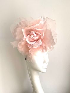 Large soft pink flower hat This amazing large pink flower hat is made from organza and velvet fabric. The hat sits on the black 10cm sinamay base which is attached to a fabric-covered headband and a comb so it will sit steadily on your hair. A large Pink flower hat will be an amazing accessory to compliment your outfit. It will fit the average head size. You can wear this amazing hat at weddings, Christenings, Horse races, and any other special occasion. Enjoy and please have a look in my shop f Rose Wedding Fascinator With Handmade Flowers, Pink Feminine Fascinator For Wedding, Pink Pinched Crown Headpiece For Races, Rose Fascinator For Wedding And Kentucky Derby, Rose Fascinator For Kentucky Derby Wedding, Pink Flower Headpiece For Wedding, Pink Flower Headpieces For Wedding, Pink Flower-shaped Party Costume Hat, Pink Flower-shaped Costume Hat For Parties