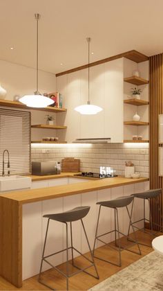 a modern kitchen with white cabinets and wooden counter tops, along with bar stools