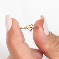 14k Heart Ring | Solid Gold Ring | Stacking Ring | Gold Dainty Ring | Gold Heart Ring | Gold Pinky Ring | Minimalist Ring | Valentines Gift ➔ Made to Order ➔ Gold Karat: 14K gold ➔ Band Width: 1.5mm (Please note that due to variations in computer/phone screens and the natural stones we use, the color of stones may vary) This ring is made to order, please allow 3-10 business days before shipping. Want it sooner? Ask us and we will let you know if it's possible! ♦︎ Check out more about our shop at: https://etsy.me/3qqqait ♦︎ Any Questions or Comments? Contact us Below: https://etsy.me/3twDq7a Go direct to our categories: Diamond Rings: https://etsy.me/4adgGMQ Diamond Earrings: https://etsy.me/41ldoTQ Diamond Necklaces: https://etsy.me/3TjKqBD Diamond Wedding Bands: https://etsy.me/3uSyCw5 Ru Heart Ring Gold, Gold Dainty Ring, Gold Ring Stacking, Gold Pinky Ring, Gold Heart Ring, Dainty Gold Rings, Diamond Necklaces, Solid Gold Ring, Phone Screens