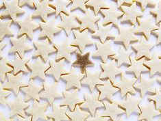 star shaped cookies are arranged on a white surface