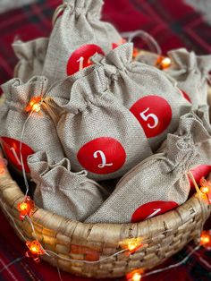 a basket filled with red balls and string lights