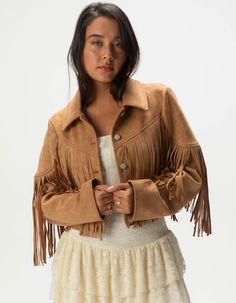 West Of Melrose Fringe Jacket. Make A Statement With This Faux Suede Fringe Jacket, Featuring A Stylish Button Front And Chic Fringe Detailing. The Soft Faux Suede Adds A Luxurious Touch, While The Fringe Brings A Fun, Bohemian Vibe. Cropped Fit. 92% Polyester, 8% Spandex. Machine Wash. Imported. Model Is Wearing A Size Small. Model Measurements:height: 5'7" Bust: 34"waist: 25"hips: 34.5" 70s Fringe Jacket, Fringe Vest Outfit, Fringed Vest Outfit, Chino Pants Women, Wwe T Shirts, Flannel Sweatshirt, Suede Fringe Jacket, The Fringe, Fringe Jacket