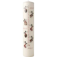 a white pillar with christmas decorations on it and the number one candle in front of it