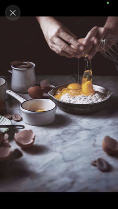 an image of someone making food in the kitchen with eggs and other ingredients on the table