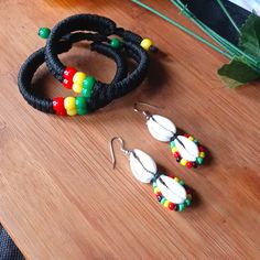 2pc Beautiful Women's Rasta Bracelet And Cowrie Shell Rasta Earrings Set. Length Of Earrings Is 3"Inches Long. Rasta Bracelet, Rasta Earrings, Brand Jewelry, Cowrie Shell, No Brand, Earrings Set, Jewelry Branding, Green Yellow, Jewelry Set