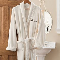 "Super soft luxurious touch micro-fleece robes are always a favorite! For bedroom, bath or casual lounging, wrap yourself in pure comfort! Rest and relaxation begin the moment you slip into one! - Custom embroidered with any name in your choice of thread color in block or script font - Kimono-style robe features two over-sized front pockets, double needle assembly, and over-sized 3/4 length cuffs for extra comfort - Quality made of 100% polyester, falling at mid-calf length, pink and ecru robe a Womens Bathrobes, Personalization Mall, Custom Robes, Embroidered Robes, Personalized Robe, Fleece Robe, Bath Gift, Christmas Stockings Personalized, Womens Robes