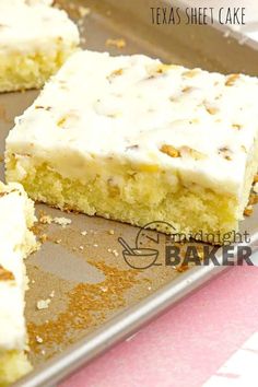 there is a piece of cake that has been cut into squares and placed on a baking sheet