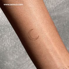 a woman's arm with a small tattoo on the left side of her arm