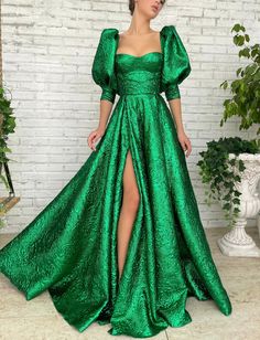 Be the jewel of the evening in our Emerald Palace Puff Gown. Show off in a gem of a garment. Our long green train leaves a trace of emerald dust inviting everyone’s eyes to your presence. The limelight is yours tonight, and always!Details:-Corse... Puff Gown, Teuta Matoshi, Green Prom, Box Pleat Skirt, Green Gown, فستان سهرة, Green Prom Dress, Half Sleeve Dresses, Fancy Dresses