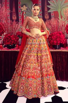 Red two layer can can attached bridal lehenga featuring multicolour thread embroidered floral blossom motifs, scalloped hem, embellished by mirrorwork, gota and bead embellishments. Comes with floral zardozi embroidered blouse and dupatta. - Aza Fashions Red Floral Embroidered Sets For Navratri, Red Sets With Floral Embroidery For Navratri, Red Anarkali Lehenga With Floral Embroidery, Red Semi-stitched Set With Floral Embroidery, Red Floral Embroidered Lehenga For Navratri, Red Floral Embroidered Dupatta For Wedding, Red Embroidered Fabric With Floral Detail For Reception, Red Anarkali Choli With Floral Embroidery, Red Choli For Traditional Ceremonies