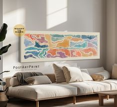 a living room filled with furniture and a painting on the wall above it's couch