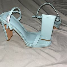 Brand New, Never Worn, Shiny Baby Blue Heels. Trendy Blue Ankle Strap Heels, Trendy Light Blue Block Heel Heels, Spring Blue Heels For Night Out, Blue Heels For Spring Night Out, Trendy Light Blue Party Heels, Blue Heels For Night Out In Spring, Trendy Light Blue Heels With Wrapped Heel, Trendy Blue Heels With Wrapped Heel, Chic Light Blue Heels For Spring