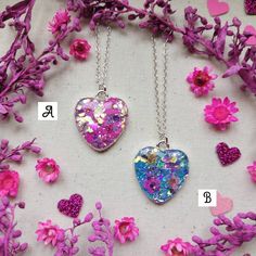 "Wear a piece of nature with one of these unique, handmade necklaces 🌿💜 ♡ Beautifully handcrafted with real flowers encased in resin with super sparkly glitter ✨ ♡ Each heart measures 2.5cm H x 2cm W  ♡ Attached to an 18\" Sterling silver chain,  ♡ Only 3 available - Red, Pink & Blue  ♡ Comes presented on a backing card with an Organza bag or the option of a lilac gift box for £1 extra - please see photos attached If you have any questions, please drop me a message 💜 Have a lovely day, Charlotte x" Handmade Heart Pendant Jewelry Keepsake, Handmade Silver Charm Necklace For Her, Handmade Heart Pendant Jewelry For Keepsake, Handmade Silver Charm Necklace As Gift For Her, Unique Silver Necklaces For Valentine's Day, Unique Silver Heart Necklace For Gift, Sterling Silver Necklace With Natural Inclusions For Gift, Unique Silver Necklace For Valentine's Day, Unique Heart Charm Jewelry Gift