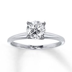 an engagement ring with a round diamond in the center