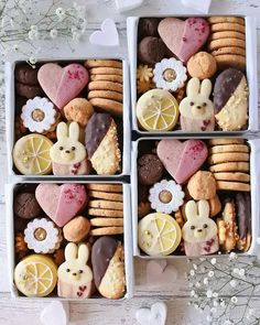 four boxes filled with different types of cookies and pastries on top of a table