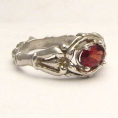 "Handmade Solid Sterling Silver Red Garnet Bone Ring 6x4mm .5ct Sizing and shipping is ALWAYS FREE with a 14 day \"No Questions Asked\" return policy. *In the notes section of your order, please specify ring size.* This ring is made with real gems. I made it myself, so if you see a setting you like and want a different gem in it, I can put in another one as they are not finished. I can probably do it for the same price or real close. I can make these either in gold or sterling silver; just email Classic Red Jewelry As A Gift, Classic Red Birthstone Jewelry, Red Garnet Ring For Gift, Oval Ruby Ring In White Gold For Gift, Formal Red Birthstone Ring With Polished Finish, Formal Red Polished Birthstone Ring, Red Sterling Silver Ring Gift, Red Gemstone Ring For Gift, Red Solitaire Rings As Gift