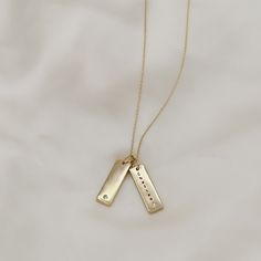 Give the gift of customization this holiday season with our gold filled tag necklace. Keep it simple with one tag or create a stacked looked and add multiple tags with different customizations to create a unique and timeless piece. Names, dates, etc. make the most thoughtful gift! These pieces are engraved in house and made to order! Include your customization in the note section on the cart page! Standard chain length is 17" with 2" of extender chain for adjusted length. Looking for a longer le Elegant Customizable Gold Birthstone Necklace, Hand Stamped Yellow Gold Necklace For Anniversary, Hand Stamped Yellow Gold Anniversary Necklace, Everyday Engraved 14k Gold Filled Charm Necklace, Personalized Charm Necklace In Recycled Gold For Everyday, Minimalist Hand Stamped Necklaces For Anniversary Gift, Personalized Tag Necklace, Minimalist Hand Stamped Necklace For Anniversary, Personalized Recycled Gold Charm Necklace As Gift