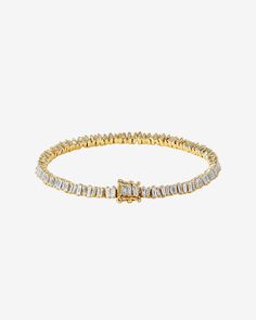 This Classic Diamond Mini Baguette Tennis Bracelet is one of our bestselling styles. We love this piece for its elegance and wear-ability. Beautiful mini baguette diamonds are meticulously set in a vertically staggered setting for a modern feel. Stack it next to one of our bangles for an elevated look. Details 18k rose gold, white gold or yellow gold 2.90 carats of baguette diamonds Bracelet measures 7" inches in length 4mm width Ref: AKB348 Modern Diamond Bracelet With Baguette Cut Accents, Modern Baguette Cut Diamond Bracelet With Accents, Modern Diamond Tennis Bracelet With Baguette Cut, Modern Baguette Cut Diamond Bracelet, Formal Diamond Bracelet With Baguette Diamonds, Modern Tennis Bracelet With Baguette Diamonds And Cubic Zirconia, Luxury Diamond Tennis Bracelet With Baguette Cut, Classic Diamond Bracelet With Baguette Diamonds, Elegant Rectangular Tennis Bracelet With Baguette Diamonds