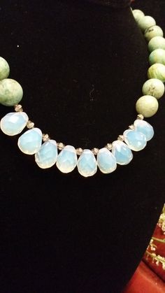 "This is a gorgeous, one of a kind, statement necklace designed and hand crafted personally by Petronella Greer. It's a 1 strand design, made of a light turquoise and opalite that turns colors. The length of the necklace is 18\". The clasp is high quality. It's an exquisite and unique piece of jewelry that no one else will have but you! Also, comes in very nice packaging!" Turquoise Chalcedony Necklace With Natural Stones, Turquoise Chalcedony Gemstone Necklace, Turquoise Chalcedony Jewelry With Natural Stones, Handmade Turquoise Chrysoprase Necklaces, Turquoise Chrysoprase Gemstone Bead Necklaces, Turquoise Faceted Bohemian Jewelry, Turquoise Chrysoprase Gemstone Bead Necklace, Bohemian Turquoise Chalcedony Necklace, Turquoise Teardrop Necklace With Faceted Beads