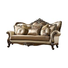 an ornate couch with pillows on it