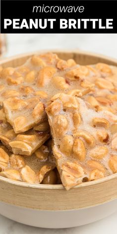 a bowl filled with peanut brittles on top of a table