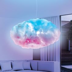 a cloud like object is suspended from the ceiling