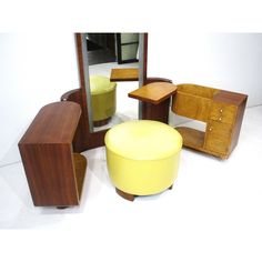 an assortment of furniture including a stool and mirror