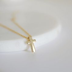 A beautiful and lovely tiny gold necklace featuring a small & cute gold cross pendant.Lobster clasp closure. Simple and warm.  The dainty gold cross necklace is perfectly paired with any outfit or a great gift! Your beautiful necklace will ship in a gift box. If you have any questions, please feel free to contact me. Thanks :)    ♥ Chain length 14"-18" ♥ Cross pendant  1/4" x 3/8" ♥ Gold plated over brass ♥ Delivery Time Fast shipping within 1 - 3 days  + See more Rudiana Accessories + www.Rudiana.etsy.com Dainty Cross Necklace For Everyday Wear, Minimalist Cross Charm Necklace With Delicate Chain, Simple Necklace With Delicate Chain And Cross Pendant, Gold Minimalist Crucifix Charm Necklace, Gold Crucifix Charm Necklace In Minimalist Style, Minimalist Gold Crucifix Charm Necklace, Dainty Crucifix Cross Necklace With Delicate Chain, Simple Yellow Gold Cross Necklace, Minimalist Cross Necklace With Delicate Chain