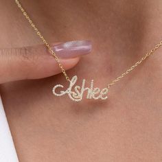 This 14k personalized diamond name necklace is the perfect gift for the bridal party, someone special, or yourself. How to order 1- Pick the fonts you like and send us a message 2- We will send you a picture of your name with the fonts you chose 3- If you like it any of them, place your order. 4- We send a final 3d mock up for approval. 5- Once approved we go ahead and finish your necklace. __________________________________________ M A T E R I A L & L E N G T H Available in 14k Yellow Gold, 14k Anniversary Diamond Name Necklace, Customizable Elegant Name Necklace For Anniversary, Custom Nameplate Necklace For Wedding, Custom Name Necklace For Wedding, Personalized Signature Style Name Necklace For Anniversary, Personalized Signature Name Necklace For Anniversary, Diamond Initials Name Necklace For Anniversary, Initials Nameplate Necklace For Anniversary, Signature Name Necklace For Mother's Day Anniversary