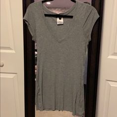 Grey Ribbed Tee. Never Worn Gray Ribbed V-neck Top, Gray Ribbed Top For Loungewear, Gray Ribbed Loungewear Tops, Fitted V-neck Tops For Loungewear, Gray V-neck Top For Loungewear, Gray V-neck Loungewear Top, Ribbed Tee, V Neck Tee, Heather Grey